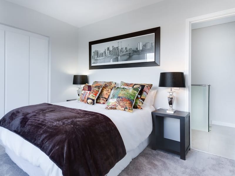 Master bedroom painted in soft chalky neutral tones with finished woodwork in Romford