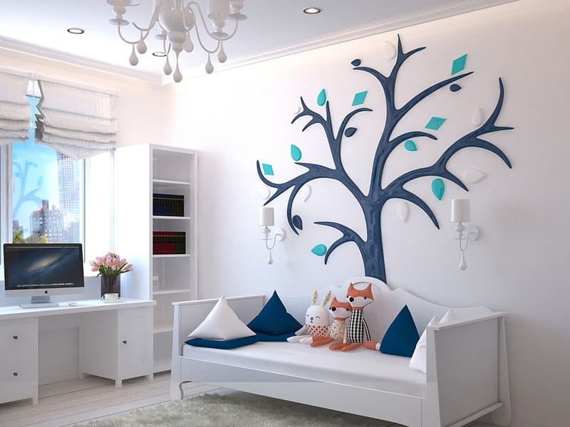 Hand-finished blue tree feature wall in a bright child’s room in Upminster