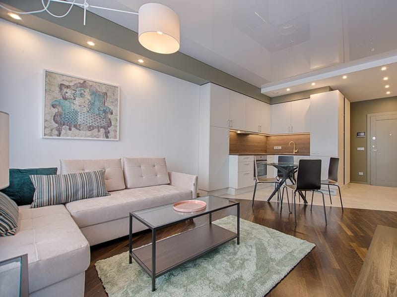 Bright open-plan living and dining room freshly painted in warm neutral tones in Hornchurch
